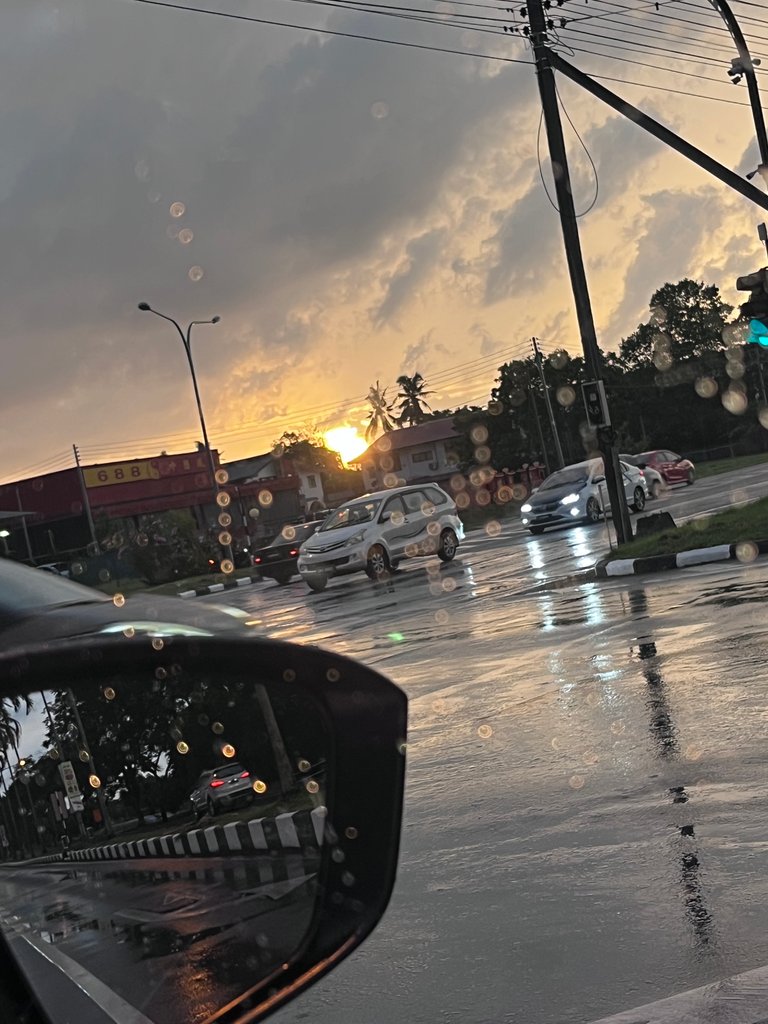 The nice view of the roads as it is still wet. I love taking photos from my car's mirror. 