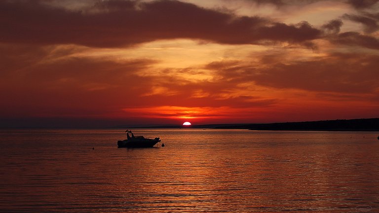 A boat at sunset by the sea - Croatia