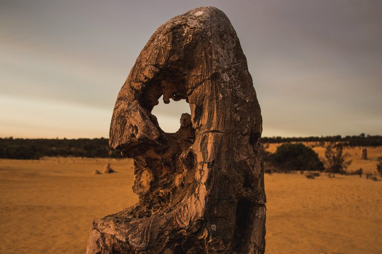 hole_through_a_limestone_formation_at_the_pinnacle_desert_1.jpg