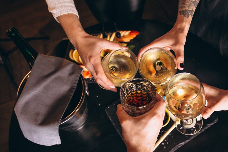 male_and_female_hands_close_up_with_cocktails.jpg