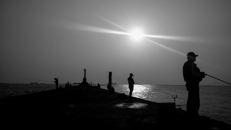 fishermen_casting_their_fishing_rods_against_the_sunset_2_1.jpg