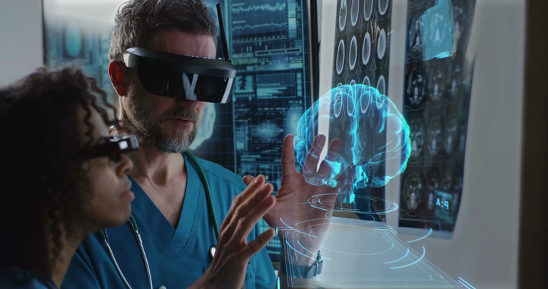videoblocks_medium_close_up_of_a_male_and_a_female_doctor_examining_3d_brain_hologram_while_wearing_vr_headsets_sktp1u5zs_thumbnail_1080_01.png