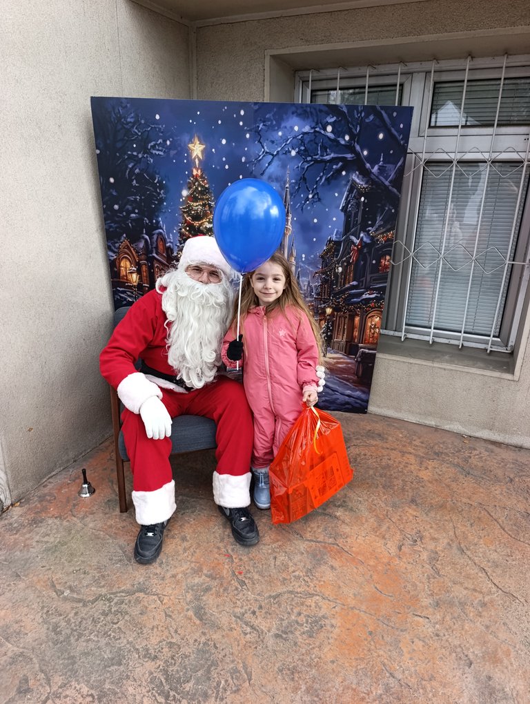 Taking photos with Santa  gave a lot of joy to Mima