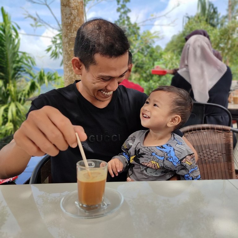 Cheerful coffee with son