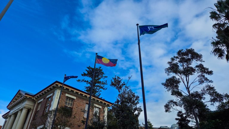Indigenous and Australia Flag Near The Court