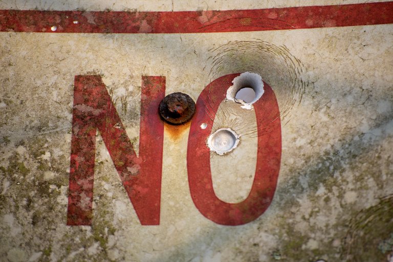 May say no parking but it don't say no shooting.