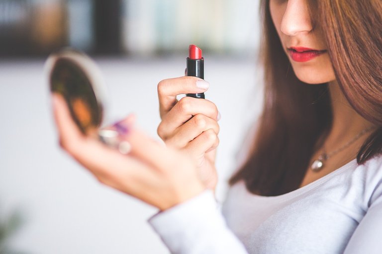 Rosa applying make-up