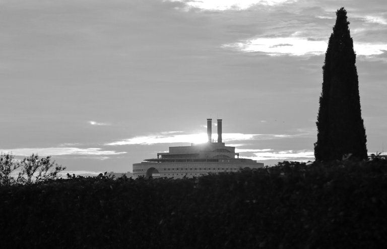 sunset_over_a_peculiar_building_on_a_cloudy_day_2_1.jpg