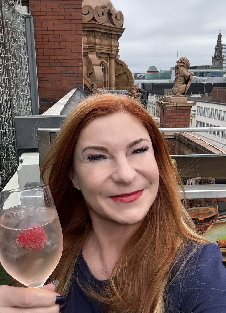 Alessandra toasts her CWH crew on their 4th Birthday from the rooftop of Harvey Nichols in Leeds, UK