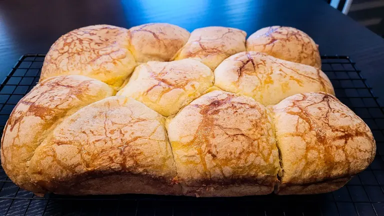 Sweet and puffy sourdough buns with homemade marmalade