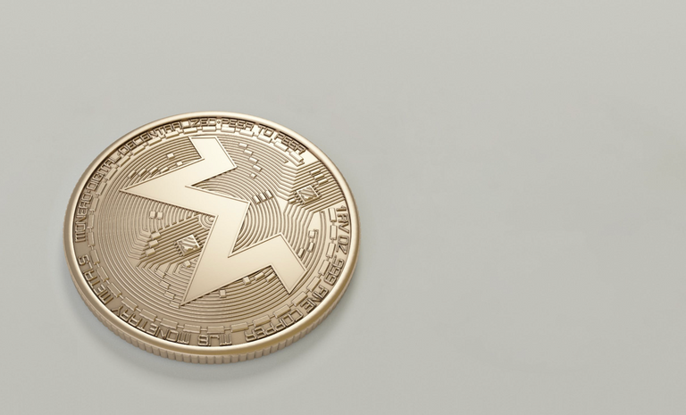A Monero (XMR) logo on a coin, representing fungibility in crypto.