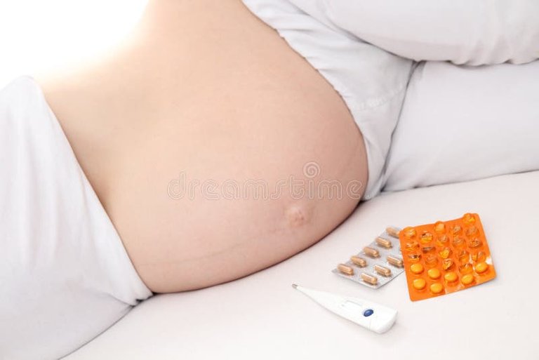 pregnant-women-medication-bed-38402479.jpg