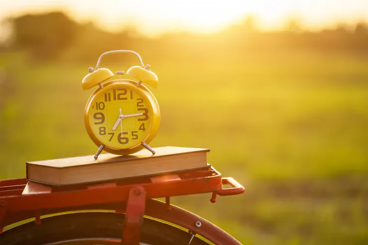 yellow-alarm-clock-book-put-red-japan-style-classic-bicycle_30478-4798.webp