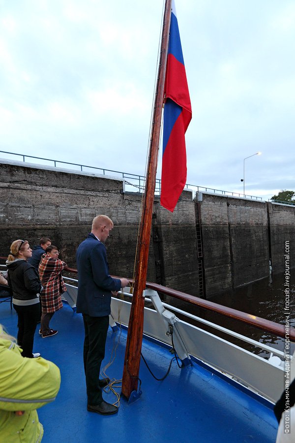 evening descent of a flag on a ship