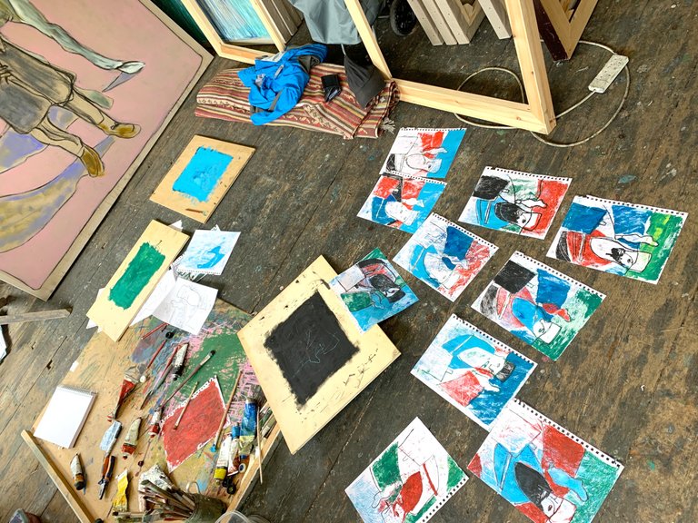Using the backs of Shelley's paintings for boards.