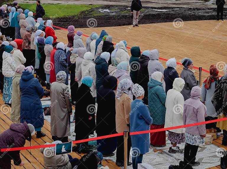 muslim-women-pray-namaz-stand-behind-red-ribbon-separately-men-kazan-russia-may-248128379.jpg