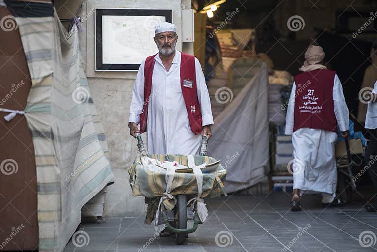 wheel-barrow-worker-souk-waqif-doha-doha-qatar-may-wheel-barrow-worker-souk-waqif-workers-used-to-load-goods-245458881.jpg