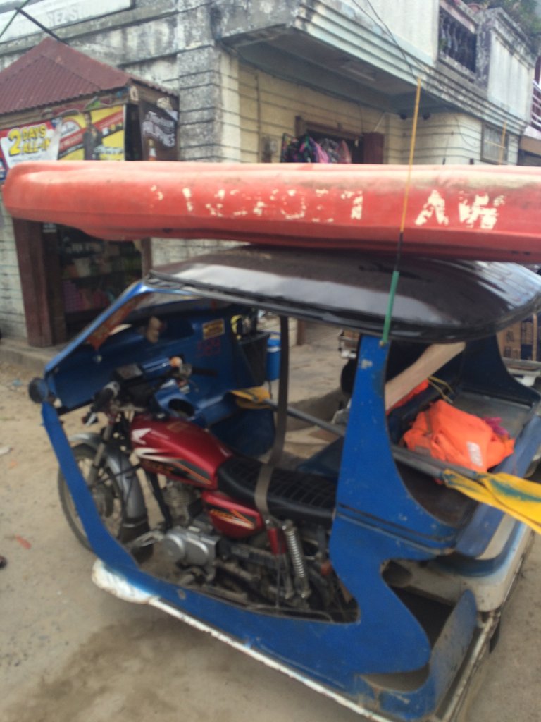 That is the way to get around town with a kayak. Tie it to the roof, all good.