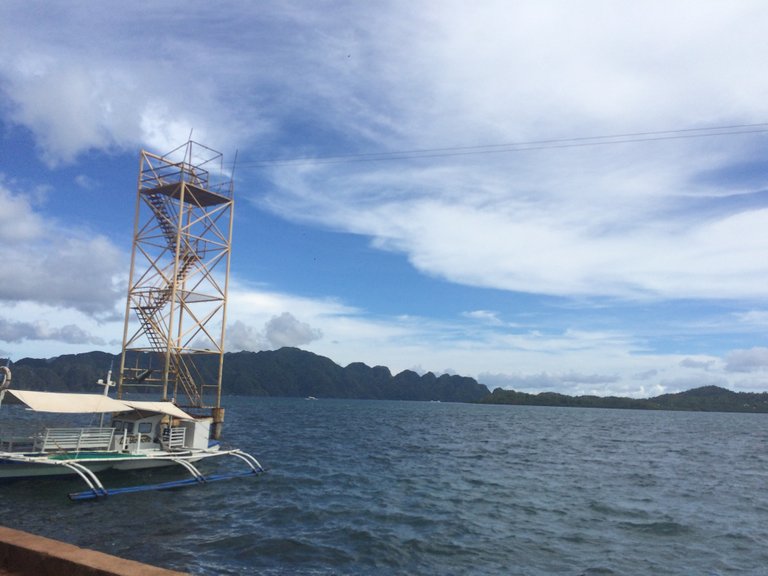 I have been fascinated with the ocean for a long time and we stop to take a moment to look at the ocean outrigger long boat waiting for passengers to arive.