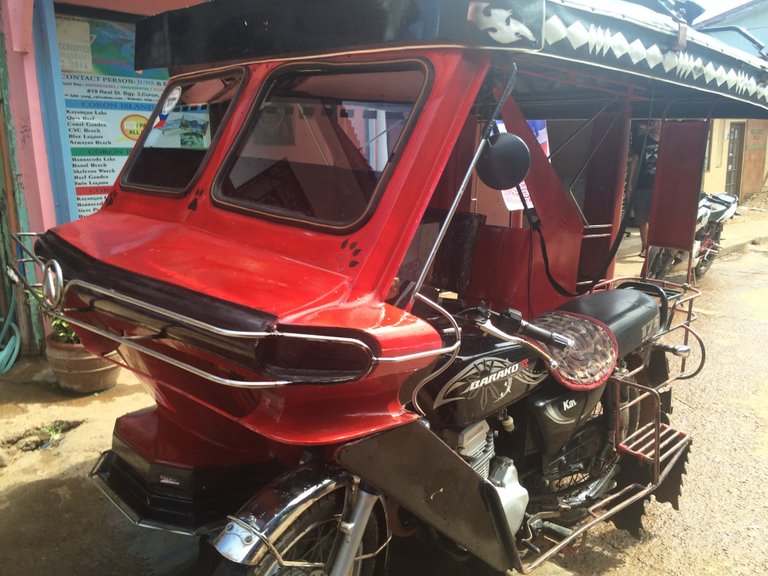 The red rocket that goes slow along the road. A fun way to see the sights when walking is too painful to make much progress.