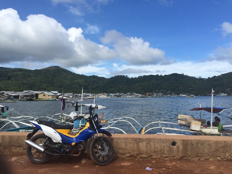 I think they will load that motorbike onto one of the boats to bring to another island. Lets not stick around to find out.