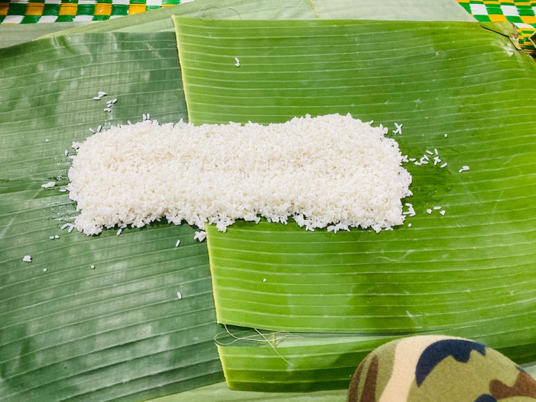 Spread out two small bowls of uncooked white rice. 