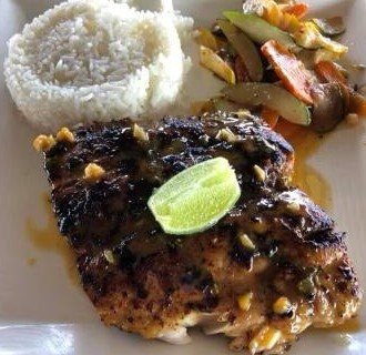 Blackened barracuda with coconut rice and sauteed veggies.