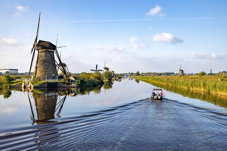 Long row of Windmill reflections at Kinderdijk, The Netherland