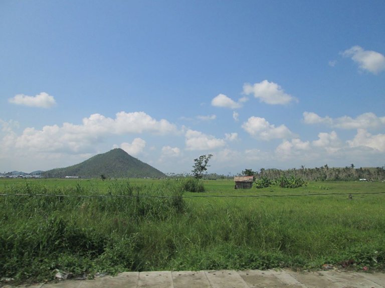 We are halfway to Tacloban City. We are all excited hehe... But before that look what we have found a wide rice field and a live volcano. We are all amazed and say Wow what a view and the rain is stopping and the sun came out very perfect to arrive in the City.