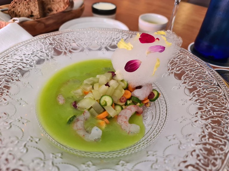 Green gazpacho with seasonal baby vegetables, raw shrimps, citrics foam and petals (€16) (1).