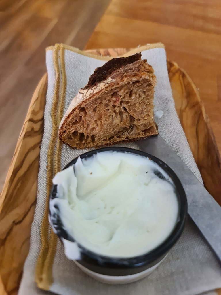 Sourdough bread and sheep butter service (€2.75).