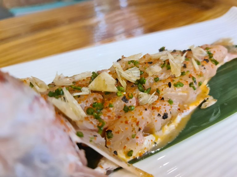 Red mullet sashimi on its spine with ”Galician caldeirada” (Galician fish stew sauce) and its fried scales (€21.90, out of menu) (1).