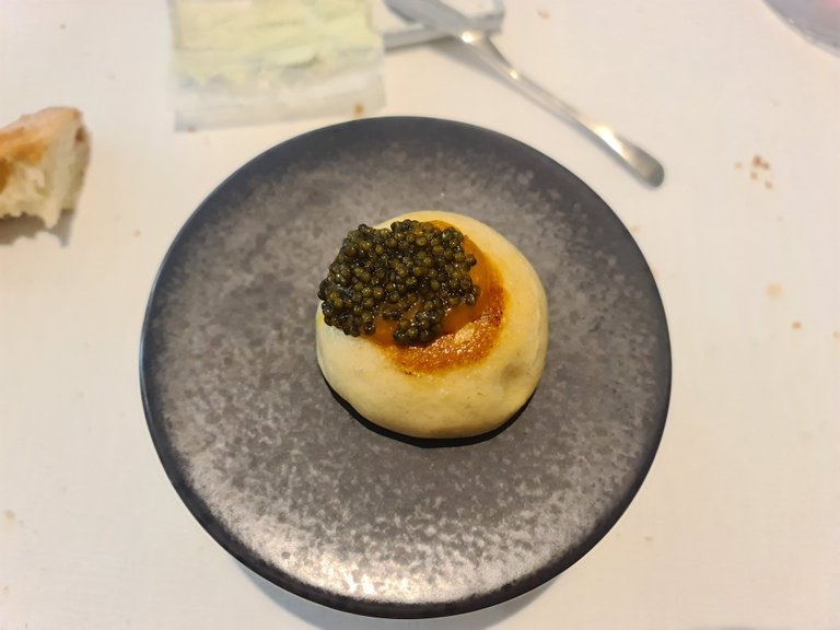 Steamed bun stuffed with eel and topped with black lemon meniere and caviar (Fifht main course) (1).