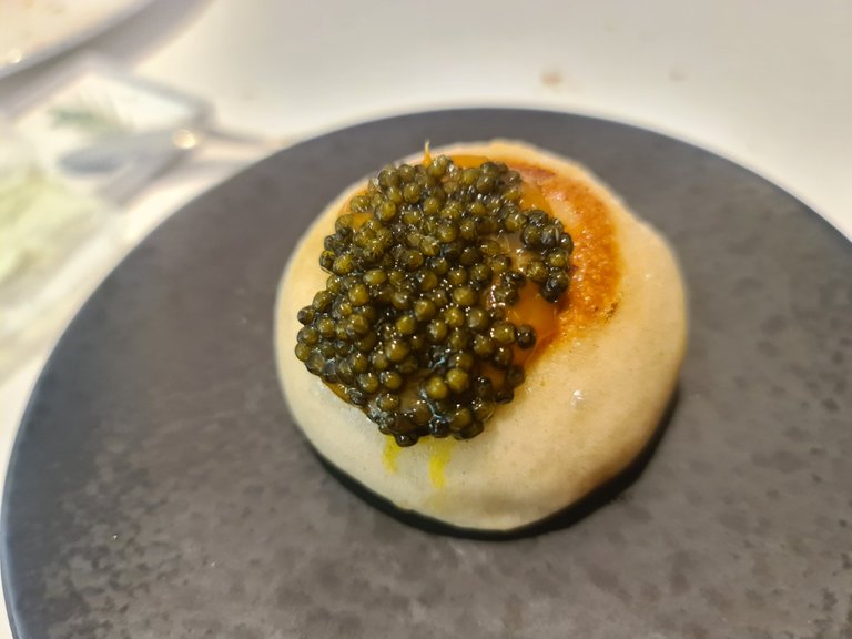 Steamed bun stuffed with eel and topped with black lemon meniere and caviar (Fifht main course) (3).