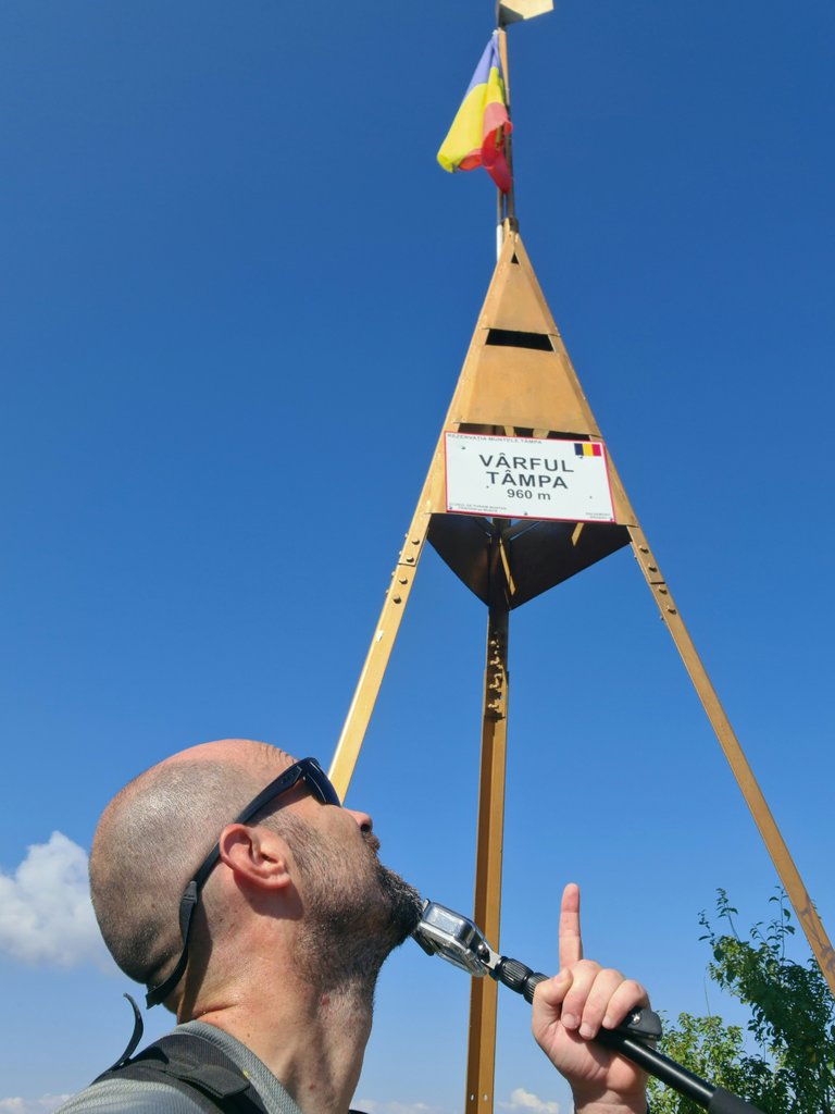 Dresden pointing the peak sign.