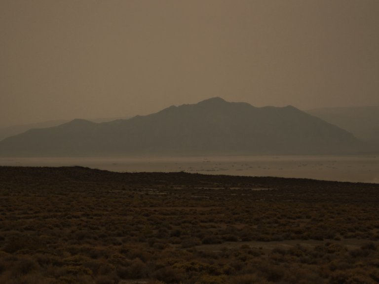 Heavy smoke from the forest fires in California has settled on Black Rock City. Old Sawtooth Mountain in the background.