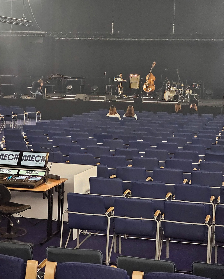 “Row four” sounded closer than it was, but the position was still good for seeing and hearing the performance.
