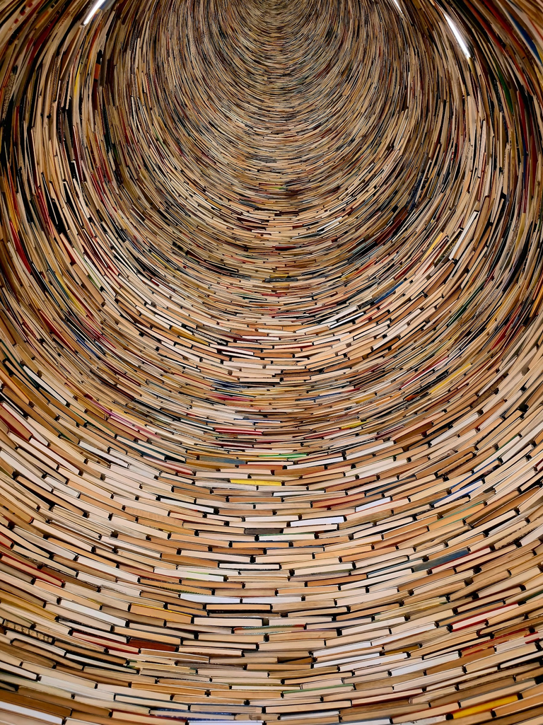Stacked books form a tunnel inside Prague’s Municipal Library.