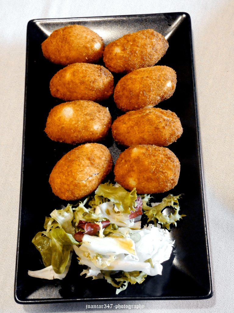 Ham croquettes, with a small salad garnish