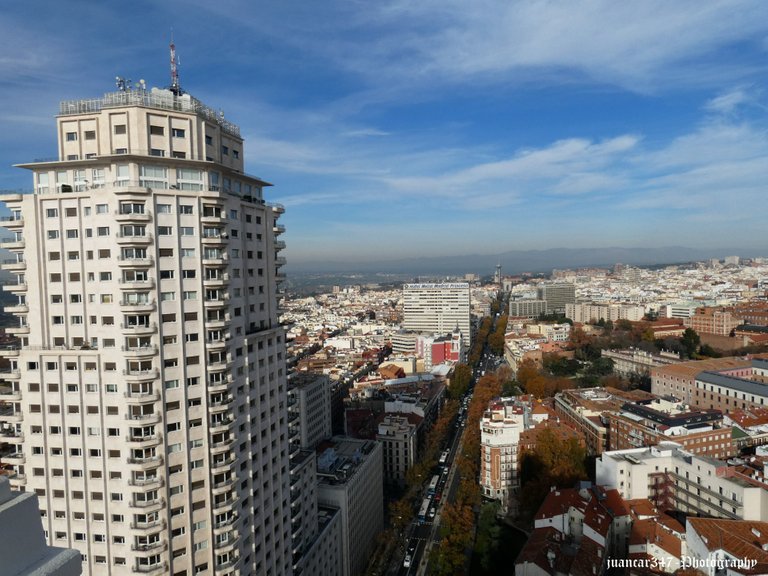 In the foreground, the grandiose Tower of Madrid