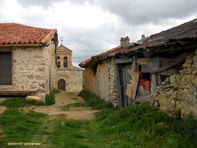 Contrast: ruin and rehabilitation. In the background, the hermitage