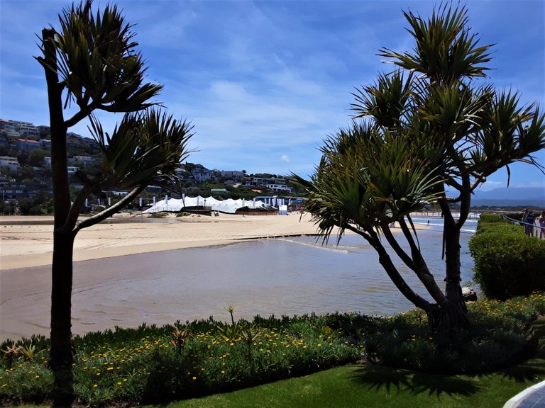 View of Central Beach from the Beacon Isle entrance with Piesang River flowing past in middle ground toward the sea