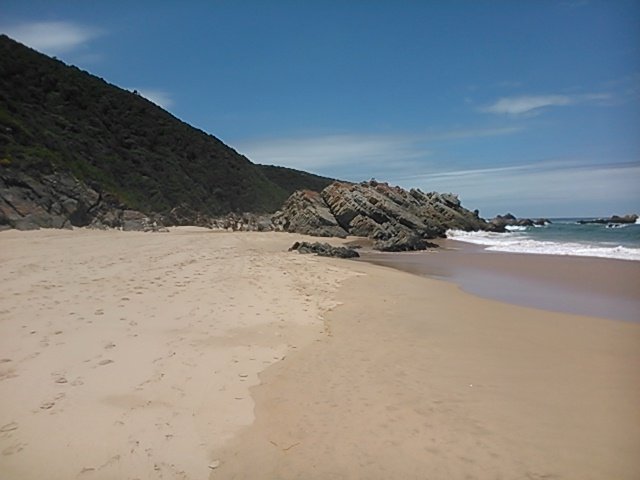 Notice the thick green dense vegetation that brings the tropical island feel to this part of the shoreline