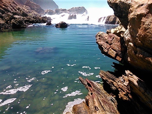 Water pours in from the ocean to fill the pool.