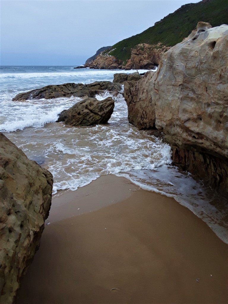 This photo, and the following one below, show the sea water flowing into a little rock channel as the tide pushes inland