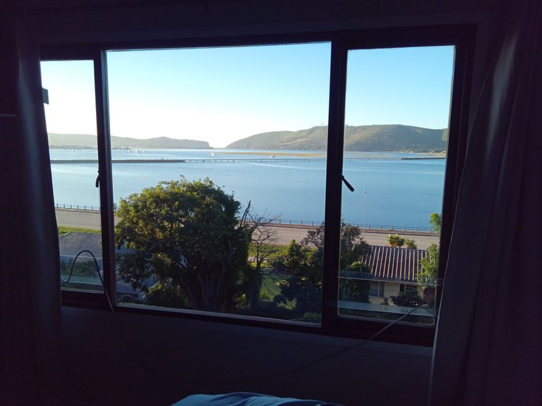 View of the Knysna lagoon with the heads in the distance through which boats can sail out to the Indian Ocean.