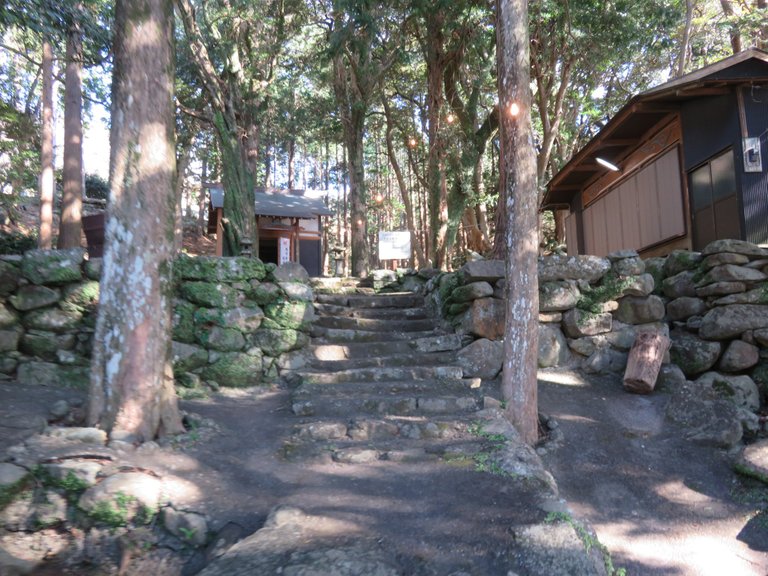 Past a little shrine and off up into the mountains again.