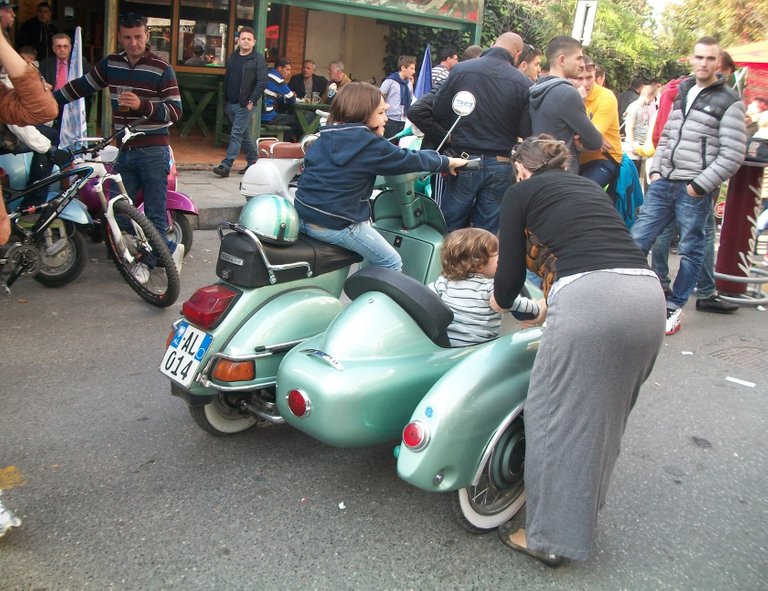 Mom letting the kids try out the sidecar