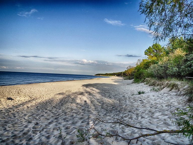 Empty beach, but only in the morning