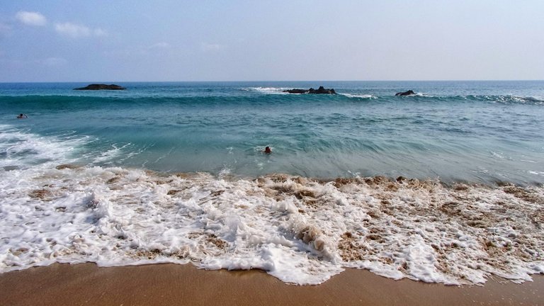 Me, swimming, and the coming wave (in the back)